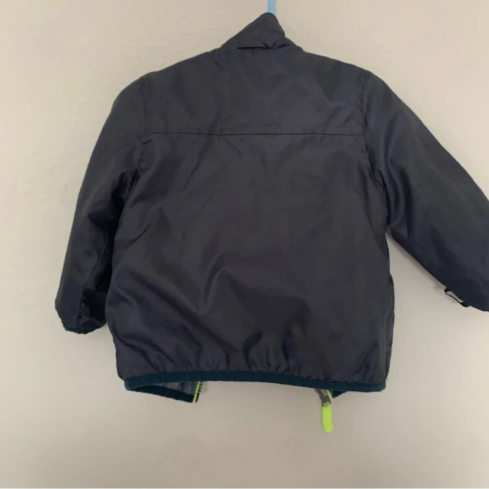 Kids Navy Blue Jacket with Neon Green Accents and zip in removable warm layer‎